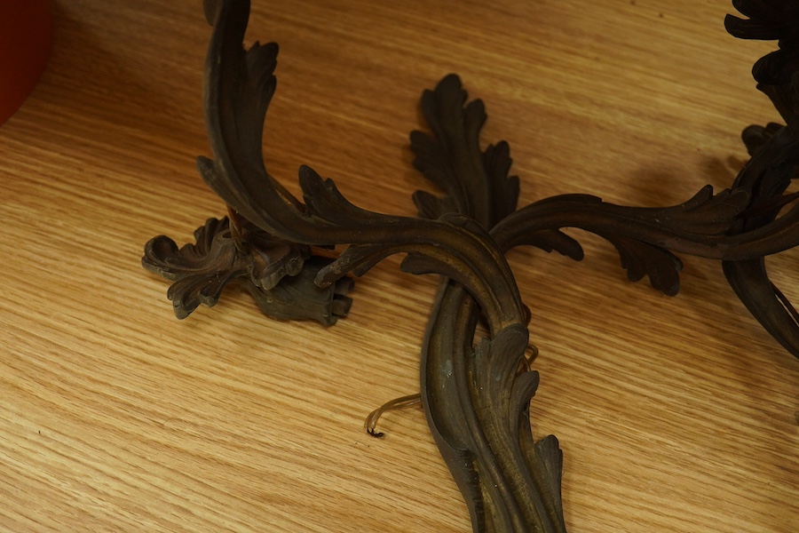 A set of four brass two branch wall scones, 37cm high. Condition - one branch broken.